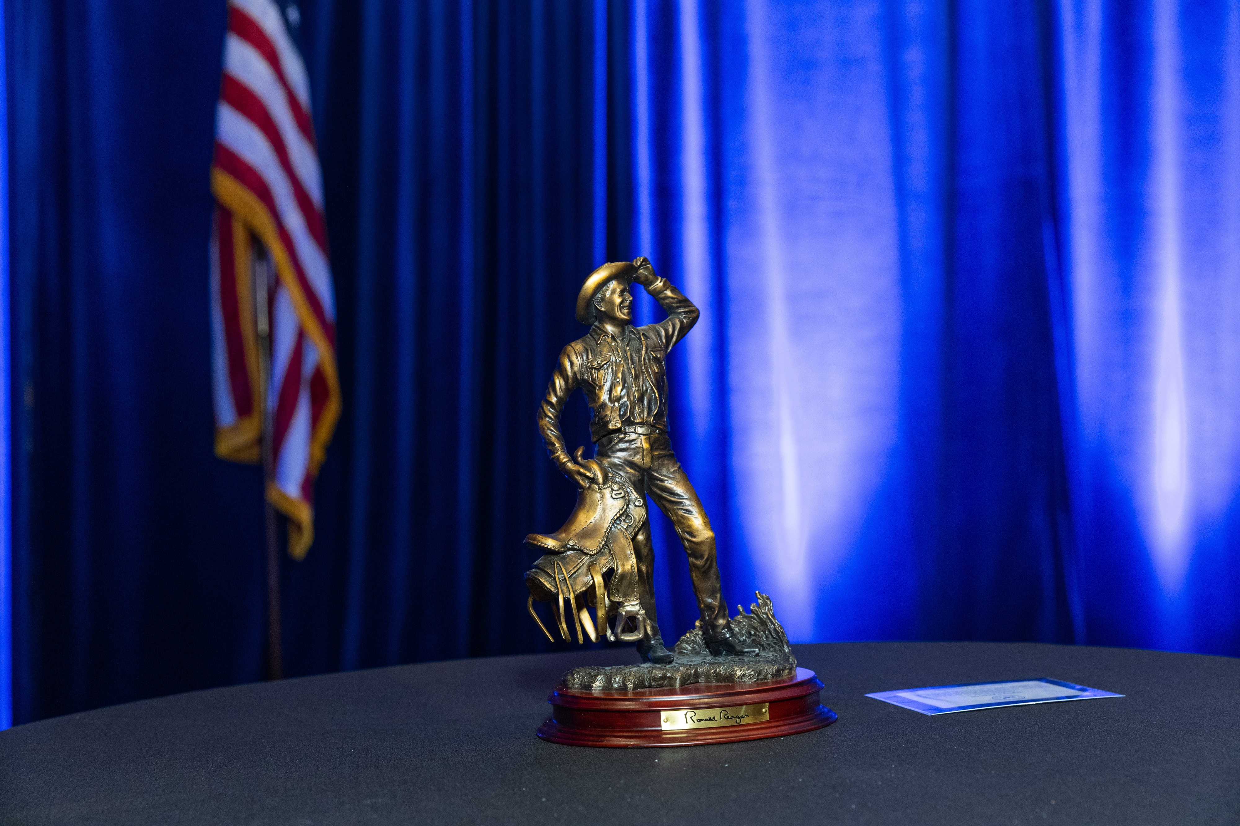 Nevada heritage — cowboy statue and American flag